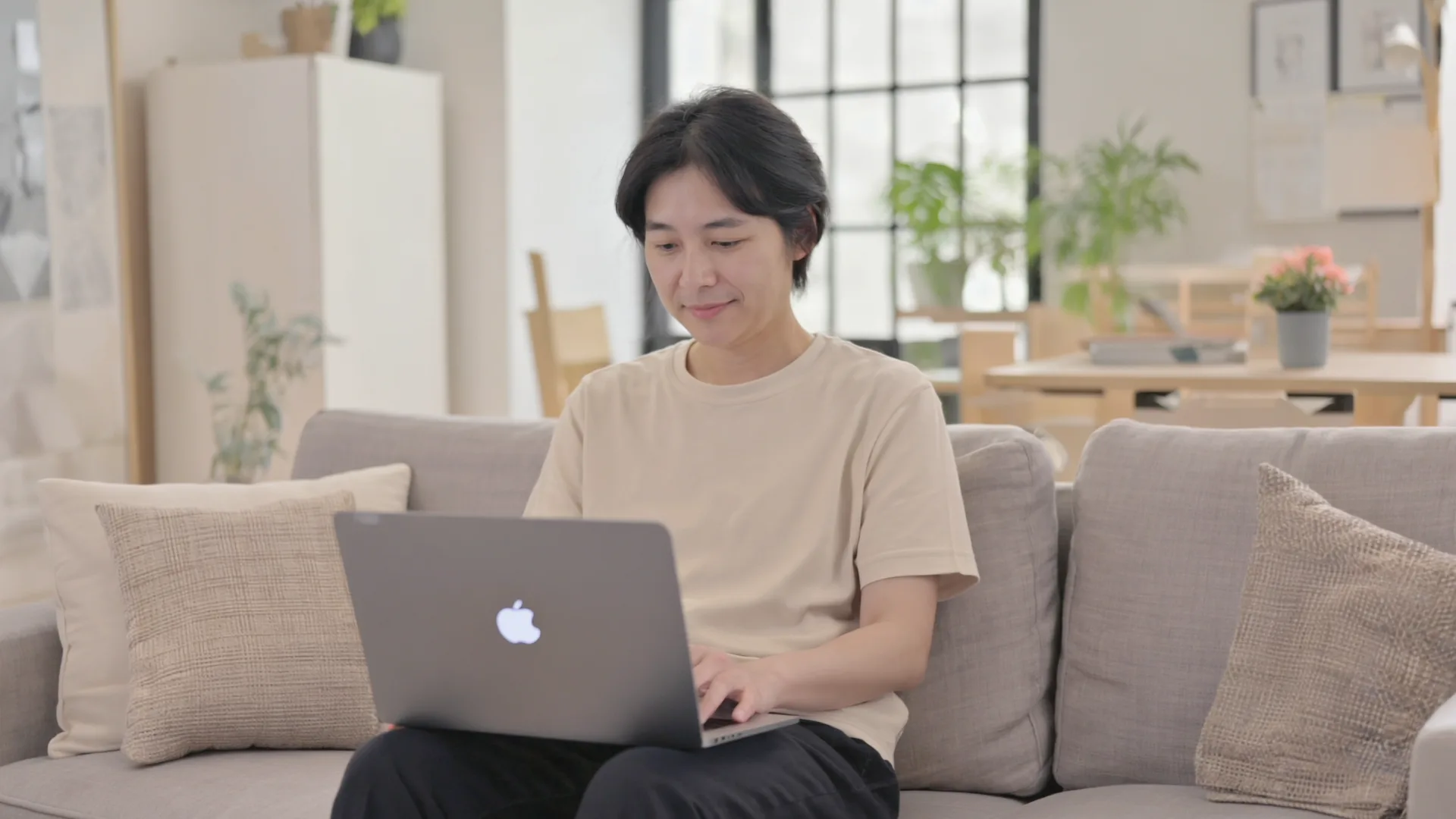 A person having a calm online video consultation with a doctor from home